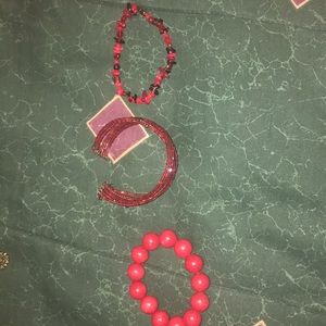 3 red bracelets
